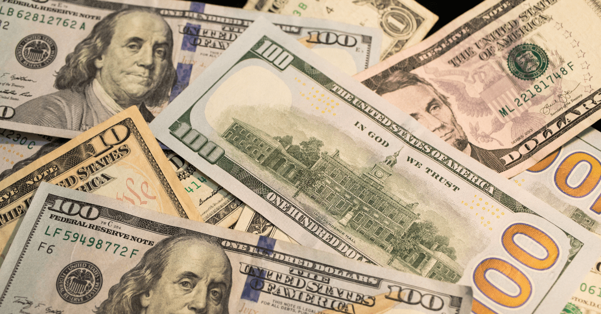 pile of hundred dollar bills